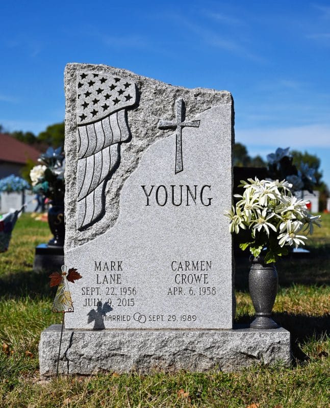 Young Memorial with American Flag Carving
